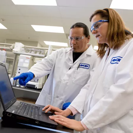 Scientists at Amgen evaluate data on a computer