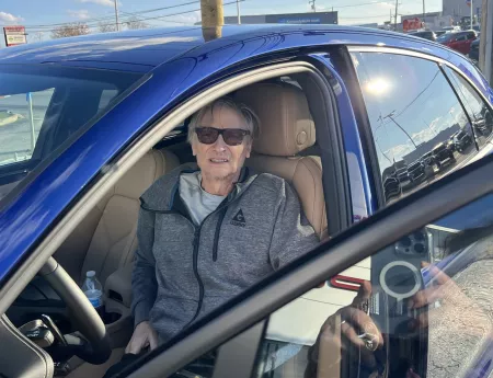 Mark Bassett in the Porsche his wife won for him in the Blue Hope Bash car raffle.