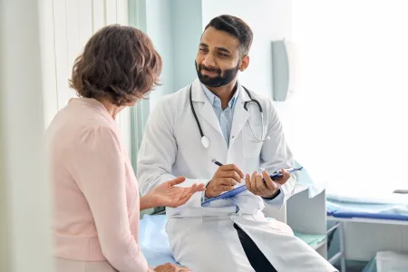 young man talking to doctor